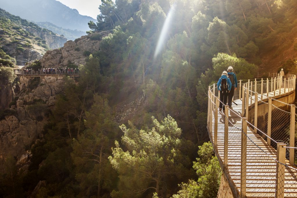 Visitors walking along the footbridge of Caminito del Rey path Malaga Spain